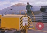 Image of Airman paints F100D plane Phu Cat Vietnam, 1968, second 21 stock footage video 65675025448