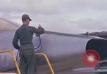 Image of Airman paints F100D plane Phu Cat Vietnam, 1968, second 23 stock footage video 65675025448