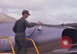 Image of Airman paints F100D plane Phu Cat Vietnam, 1968, second 27 stock footage video 65675025448