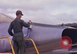 Image of Airman paints F100D plane Phu Cat Vietnam, 1968, second 28 stock footage video 65675025448