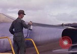 Image of Airman paints F100D plane Phu Cat Vietnam, 1968, second 29 stock footage video 65675025448