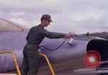 Image of Airman paints F100D plane Phu Cat Vietnam, 1968, second 31 stock footage video 65675025448