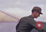 Image of Airman paints F100D plane Phu Cat Vietnam, 1968, second 35 stock footage video 65675025448