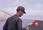 Image of Airman paints F100D plane Phu Cat Vietnam, 1968, second 37 stock footage video 65675025448
