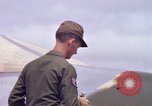 Image of Airman paints F100D plane Phu Cat Vietnam, 1968, second 38 stock footage video 65675025448