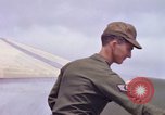 Image of Airman paints F100D plane Phu Cat Vietnam, 1968, second 40 stock footage video 65675025448
