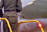 Image of Airman paints F100D plane Phu Cat Vietnam, 1968, second 41 stock footage video 65675025448