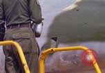Image of Airman paints F100D plane Phu Cat Vietnam, 1968, second 45 stock footage video 65675025448