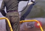 Image of Airman paints F100D plane Phu Cat Vietnam, 1968, second 46 stock footage video 65675025448