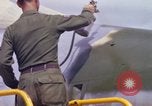 Image of Airman paints F100D plane Phu Cat Vietnam, 1968, second 47 stock footage video 65675025448