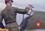 Image of Airman paints F100D plane Phu Cat Vietnam, 1968, second 49 stock footage video 65675025448