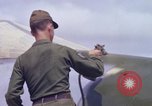 Image of Airman paints F100D plane Phu Cat Vietnam, 1968, second 52 stock footage video 65675025448