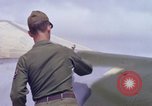 Image of Airman paints F100D plane Phu Cat Vietnam, 1968, second 53 stock footage video 65675025448