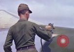 Image of Airman paints F100D plane Phu Cat Vietnam, 1968, second 54 stock footage video 65675025448