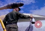 Image of Airman paints F100D plane Phu Cat Vietnam, 1968, second 56 stock footage video 65675025448