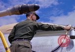 Image of Airman paints F100D plane Phu Cat Vietnam, 1968, second 57 stock footage video 65675025448