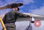 Image of Airman paints F100D plane Phu Cat Vietnam, 1968, second 58 stock footage video 65675025448