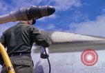Image of Airman paints F100D plane Phu Cat Vietnam, 1968, second 59 stock footage video 65675025448