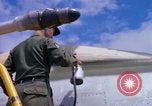 Image of Airman paints F100D plane Phu Cat Vietnam, 1968, second 60 stock footage video 65675025448