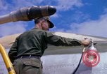 Image of Airman paints F100D plane Phu Cat Vietnam, 1968, second 61 stock footage video 65675025448