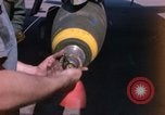 Image of United States Air Force airmen fuse 500 lb GP bombs Phu Cat Vietnam, 1968, second 8 stock footage video 65675025450