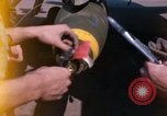 Image of United States Air Force airmen fuse 500 lb GP bombs Phu Cat Vietnam, 1968, second 12 stock footage video 65675025450