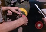 Image of United States Air Force airmen fuse 500 lb GP bombs Phu Cat Vietnam, 1968, second 13 stock footage video 65675025450