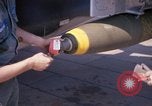 Image of United States Air Force airmen fuse 500 lb GP bombs Phu Cat Vietnam, 1968, second 61 stock footage video 65675025450