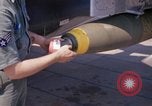 Image of United States Air Force airmen fuse 500 lb GP bombs Phu Cat Vietnam, 1968, second 62 stock footage video 65675025450
