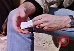 Image of hoodlums mugging man  United States USA, 1974, second 3 stock footage video 65675025490
