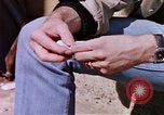 Image of hoodlums mugging man  United States USA, 1974, second 4 stock footage video 65675025490