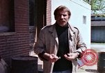 Image of hoodlums mugging man  United States USA, 1974, second 17 stock footage video 65675025490