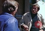 Image of hoodlums mugging man  United States USA, 1974, second 25 stock footage video 65675025490