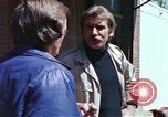 Image of hoodlums mugging man  United States USA, 1974, second 26 stock footage video 65675025490