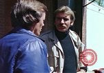Image of hoodlums mugging man  United States USA, 1974, second 28 stock footage video 65675025490