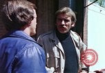 Image of hoodlums mugging man  United States USA, 1974, second 30 stock footage video 65675025490