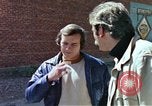 Image of hoodlums mugging man  United States USA, 1974, second 33 stock footage video 65675025490