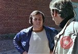 Image of hoodlums mugging man  United States USA, 1974, second 35 stock footage video 65675025490