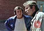 Image of hoodlums mugging man  United States USA, 1974, second 36 stock footage video 65675025490