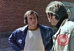 Image of hoodlums mugging man  United States USA, 1974, second 37 stock footage video 65675025490