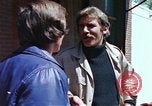 Image of hoodlums mugging man  United States USA, 1974, second 38 stock footage video 65675025490