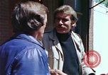 Image of hoodlums mugging man  United States USA, 1974, second 39 stock footage video 65675025490