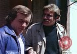 Image of hoodlums mugging man  United States USA, 1974, second 41 stock footage video 65675025490