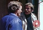 Image of hoodlums mugging man  United States USA, 1974, second 43 stock footage video 65675025490