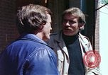 Image of hoodlums mugging man  United States USA, 1974, second 44 stock footage video 65675025490