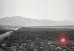 Image of Holt tractor pulling trucks through wet sand Nevada United States USA, 1919, second 4 stock footage video 65675025558