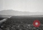 Image of Holt tractor pulling trucks through wet sand Nevada United States USA, 1919, second 7 stock footage video 65675025558