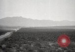 Image of Holt tractor pulling trucks through wet sand Nevada United States USA, 1919, second 8 stock footage video 65675025558