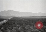 Image of Holt tractor pulling trucks through wet sand Nevada United States USA, 1919, second 9 stock footage video 65675025558