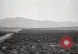 Image of Holt tractor pulling trucks through wet sand Nevada United States USA, 1919, second 11 stock footage video 65675025558